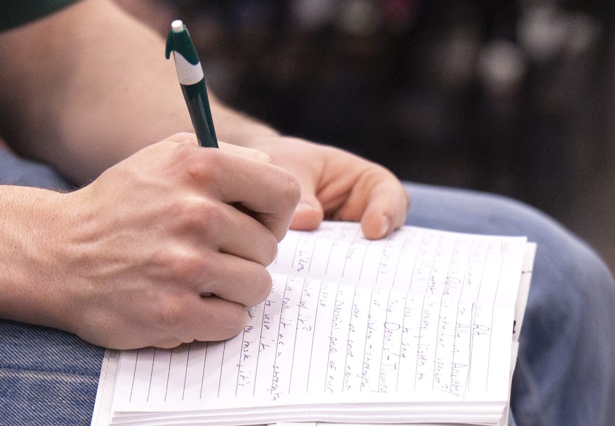 Western Kentucky University students take notes as Dr. Tracy Dennis-Tiwary speaks about “scheduled worry sessions” during the “Why Anxiety Is Good for You,” Wedge Seminar on Tuesday, March. 10, 2026 at the Alumni Center Ballroom.