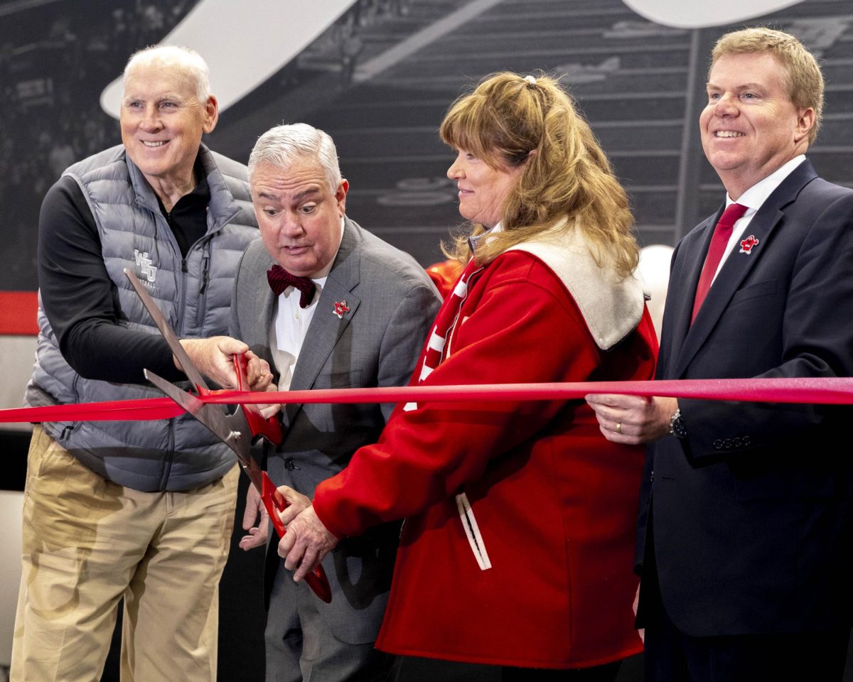President Timothy Caboni cuts the ribbon to open the Tim and Sarah Ford Fieldhouse on Tuesday, March 24, 2026 after an ice storm at the beginning of the semester postponed the event from early February to late March. 