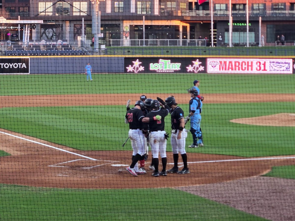 WKU batters stand at home plate after a home run by Lane Arroyos (26) at First Horizon Park on Wednesday, March 18, 2026. 