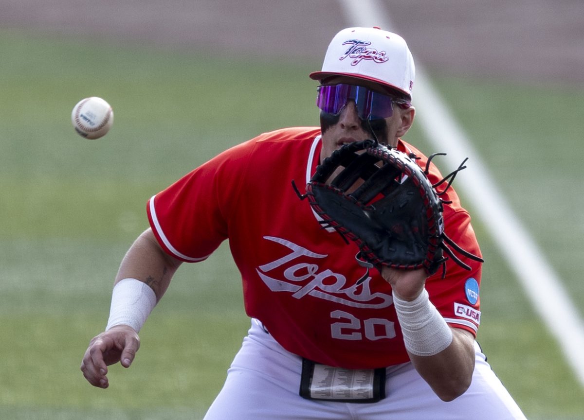 Western Kentucky University Hilltoppers catcher and infielder Kyle Hayes (20) catches the ball while Indiana University Hoosier infielder Landen Fry (25) runs to first base on Sunday, March 1, 2026 during a home game against the Indiana University Hoosiers.