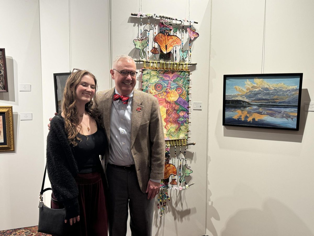 President Timothy Caboni poses with artist Molly Phelps at the Celebration of the Arts event at the Kentucky Museum on Friday, Feb. 27, 2026.