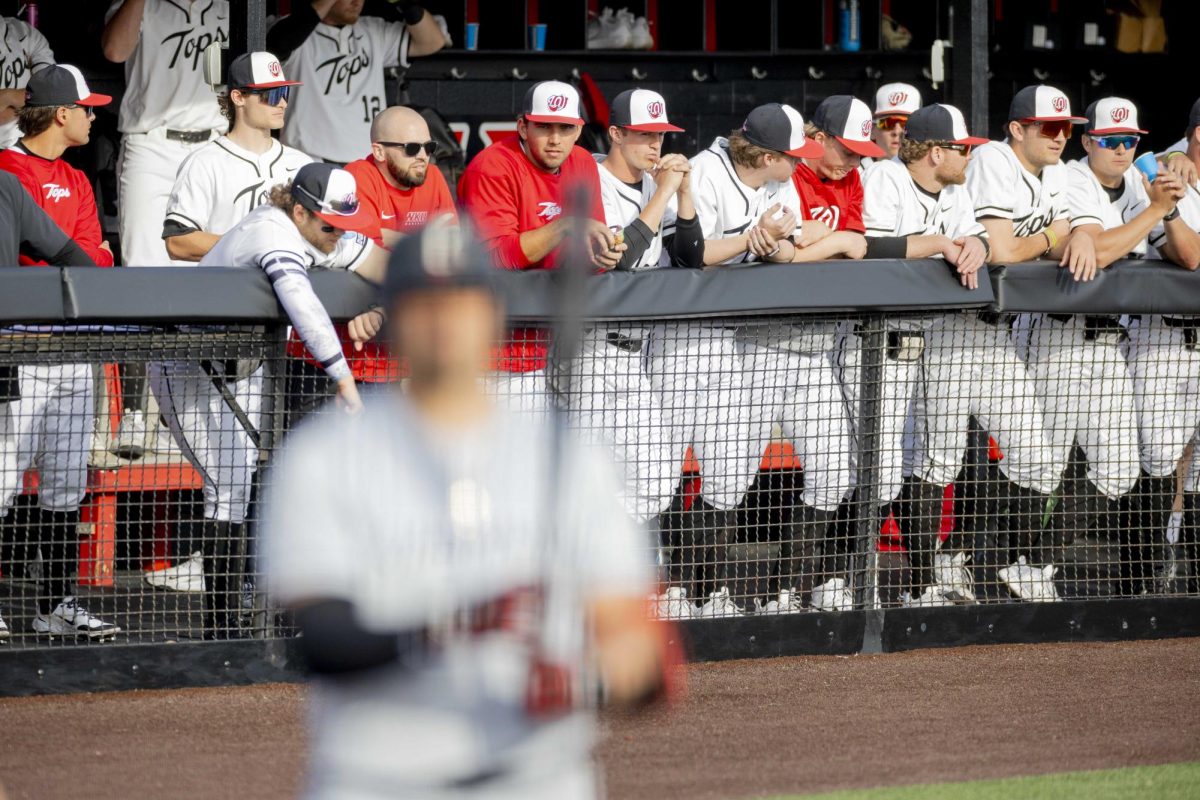 Western Kentucky Hilltoppers team lines up against the rails within the dugout as they watch the game against the Cincinnati Bearcats at Nick Denes Field on Tuesday, March 3, 2026.
