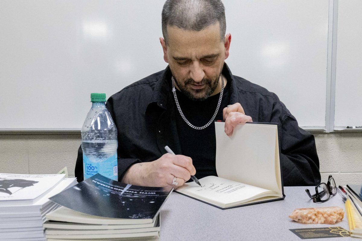 Poet Manny Grimaldi signs books after the book reading presented by WKU’s English Department in Grise Hall on Monday, April 6, 2026. 
