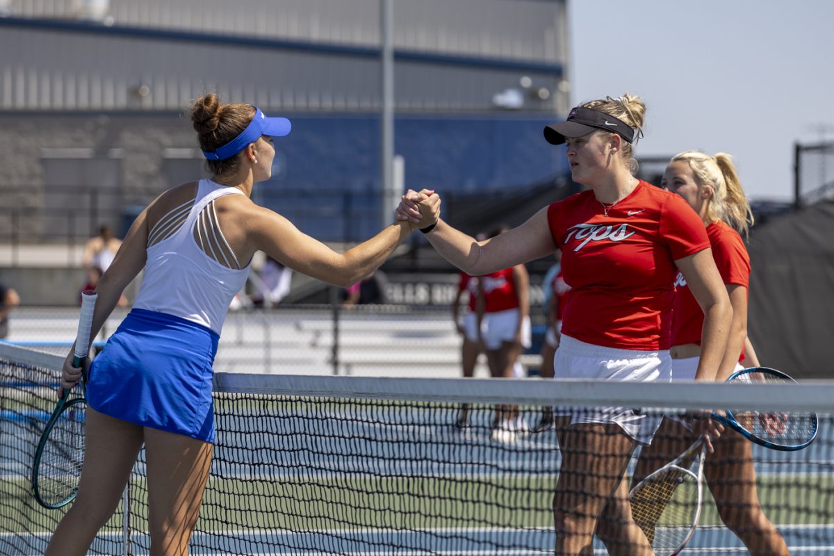 Western senior Elizabeth Sobieski and freshman Isabelle EIness approach the net to shake hands with their opponents at the end of Western’s match against Middle Tennessee State University at the Warren County Tennis Facility at Michael O. Buchanon Park on Thursday, April 9, 2026. The match took place during Sobieski’s Senior Day, with a ceremony having taken place prior to the match recognizing senior Carolina Chiatti and herself.