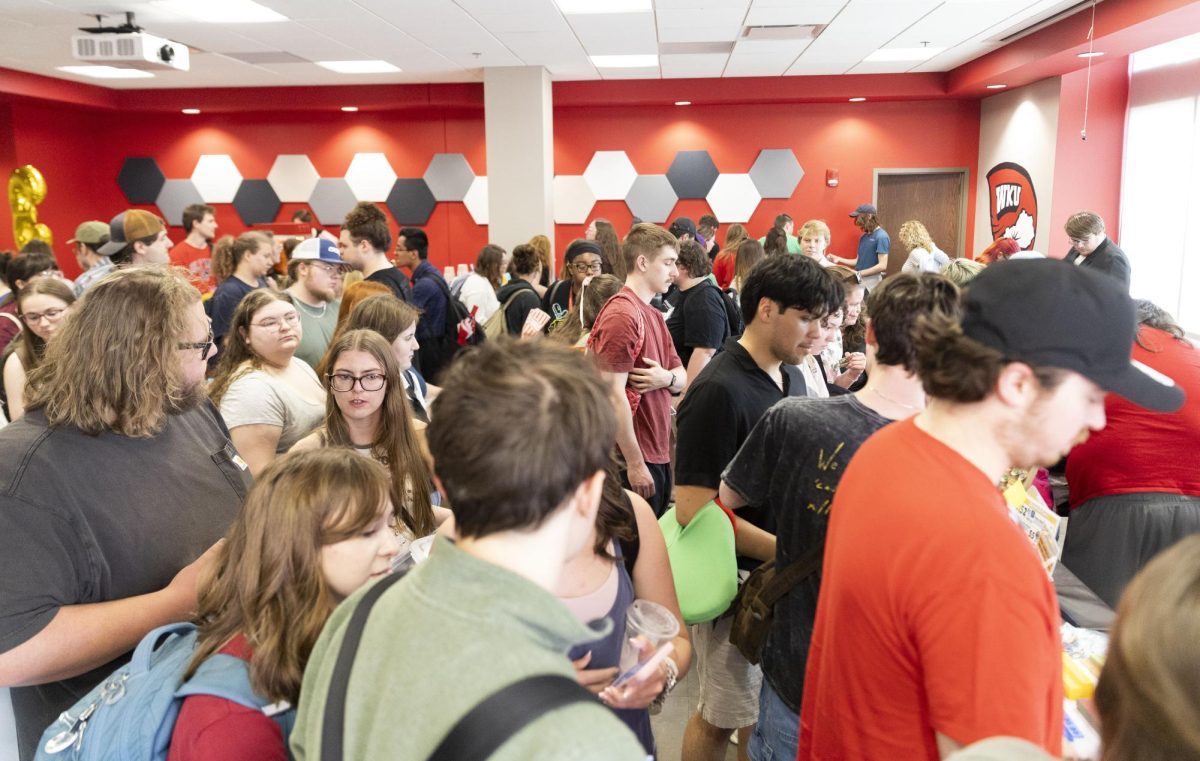 Students and fans swarm the ticket table during the third TopperFella trade day in Downing Student Union on Friday, April 10, 2026. Fans required a ticket in order to play various games around the room to win additional TopperFellas. 