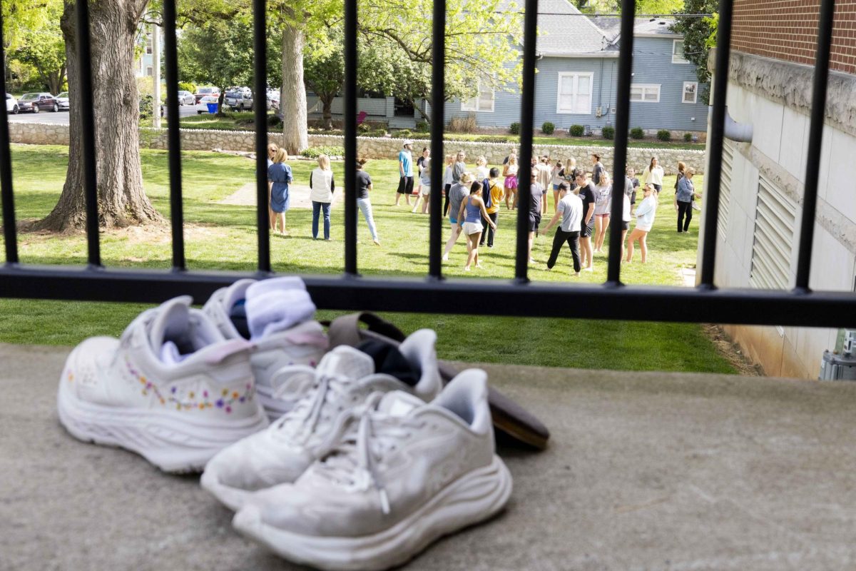 Nursing students set their shoes outside Ogden College Hall to  spend the first 30 minutes of Health Promotion and Disease Prevention class barefoot on the grass on Friday, April 10, 2026.