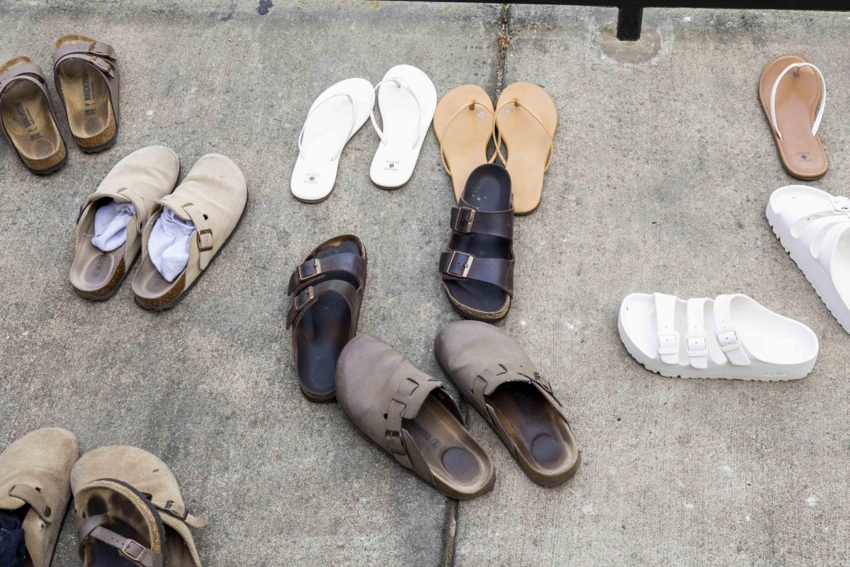 Nursing students set their shoes outside Ogden College Hall to  spend the first 30 minutes of Health Promotion and Disease Prevention class barefoot on the grass on Friday, April 10, 2026.