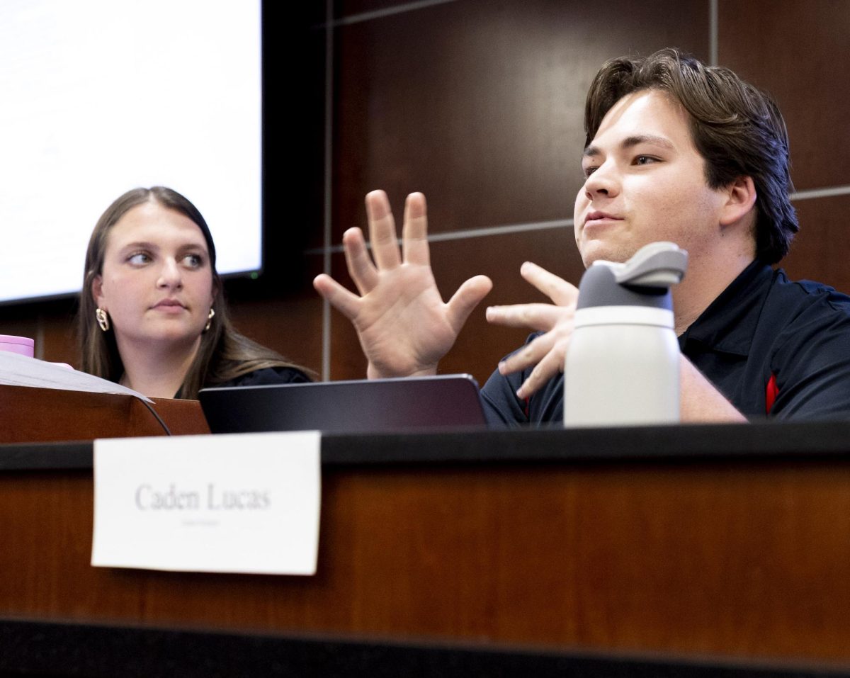 Legislative Operations Committee Chair Caden Lucas gives his report during the weekly SGA meeting on Tuesday, April 14, 2026 in Senate Chambers. Lucas is currently running against ISEC Senator Jaden Marshall for the role of Student-Body President.