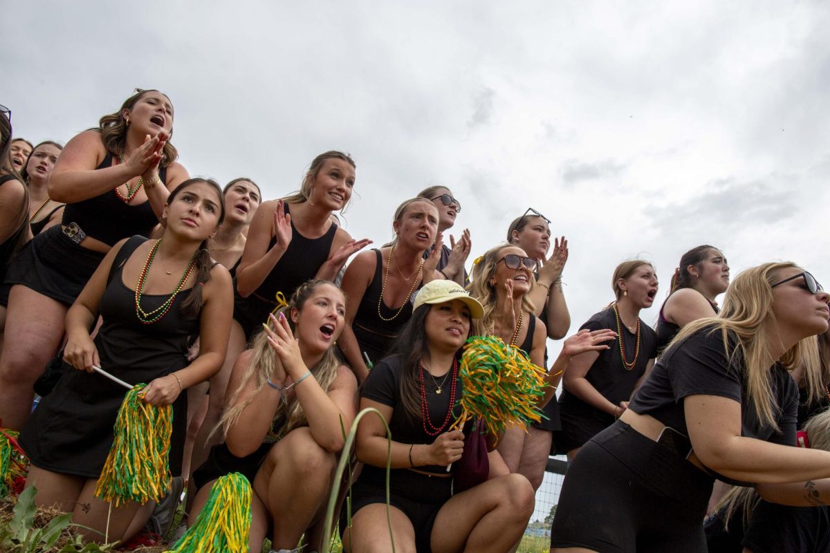 Alpha Gamma Delta sorority sisters cheer for their team in the third round during the annual Greek Week “Tug” competition at the WKU Agricultural Research and Education Center on Friday, April 24, 2026. 