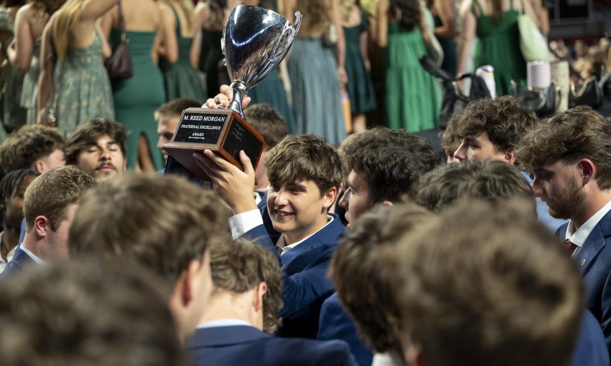 A member of Sigma Phi Epsilon holds the M. Reed Morgan Fraternal Excellence Award after the Greek Week Convocation ceremony in E.A. Diddle Arena on Sunday, April 26, 2026.