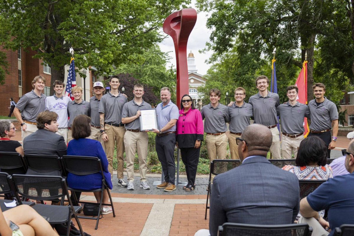 Mayor Todd Alcott and Commissioner Melinda Hill present the proclamation to Team 14 during the Bike4Alz proclamation signing ceremony in Centennial Mall on Tuesday, April 28, 2026. 