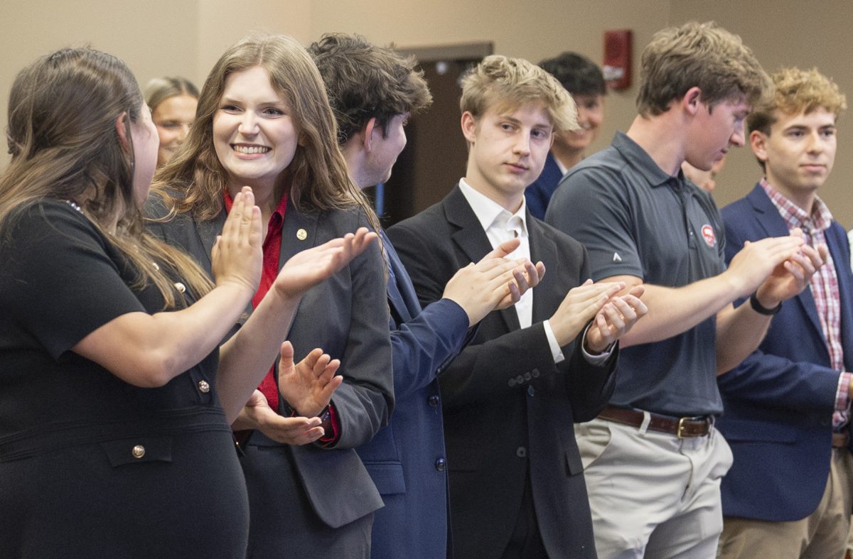 Newly appointed Senate Speaker Veronica Butler celebrates with fellow Student Government Association members after being sworn in during the meeting on Tuesday, April 28, 2026, in the senate chambers.