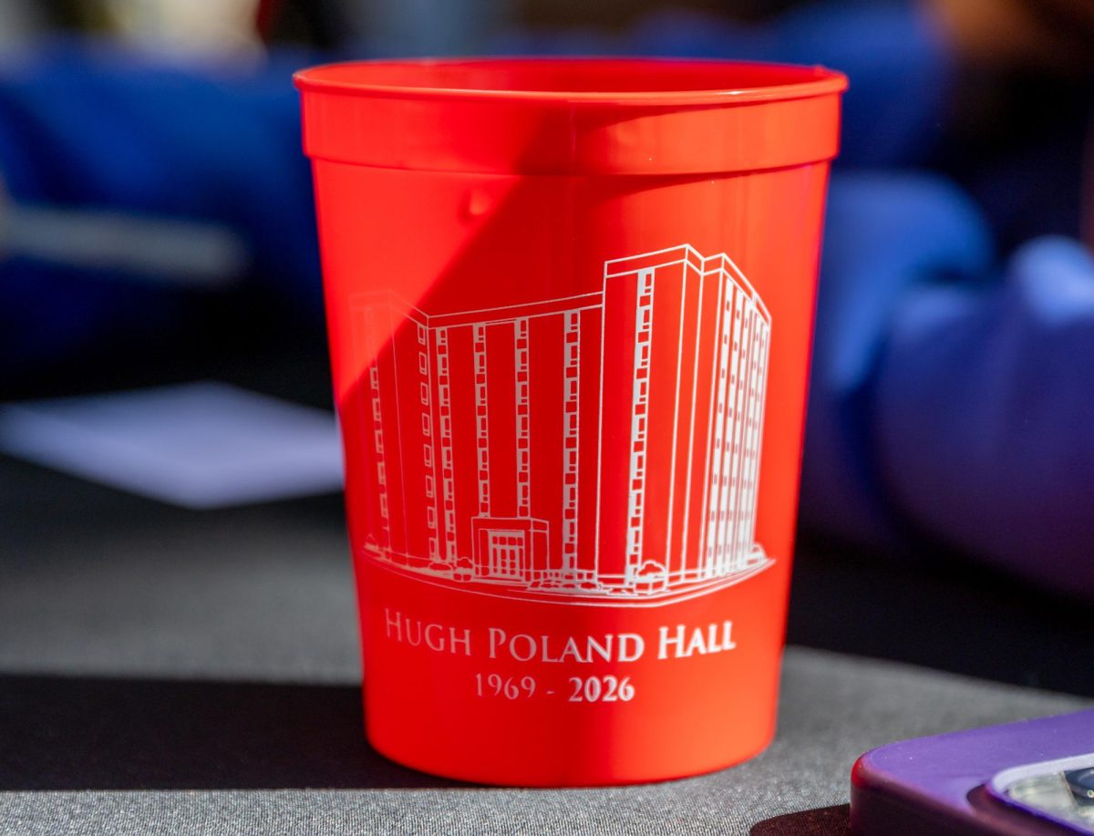 Memorial cups for Hugh Poland and Douglas Keen, given to students and attendees, sit on a table at Western Kentucky University, Thursday, April 30, 2026.