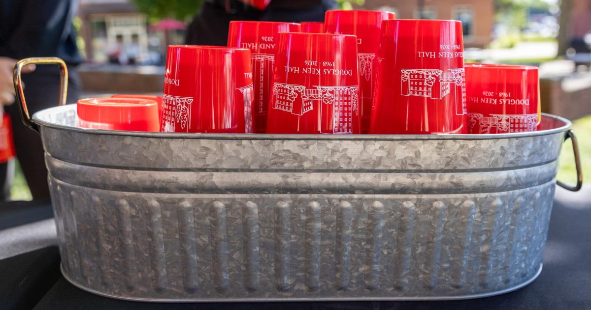 Memorial cups for Hugh Poland and Douglas Keen, given to students and attendees, sit on a table at Western Kentucky University, Thursday, April 30, 2026.