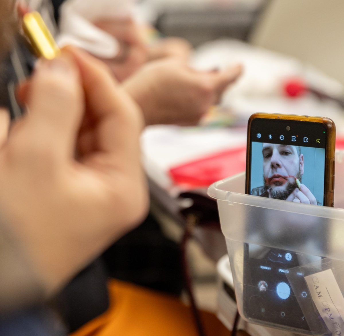 Coleman Glorioso (34) applies clown makeup during the April Fools’ Clowning Hour at the Warren County Public Library Bob Kirby Branch in Bowling Green, Kentucky, on Wednesday, April 1, 2026.