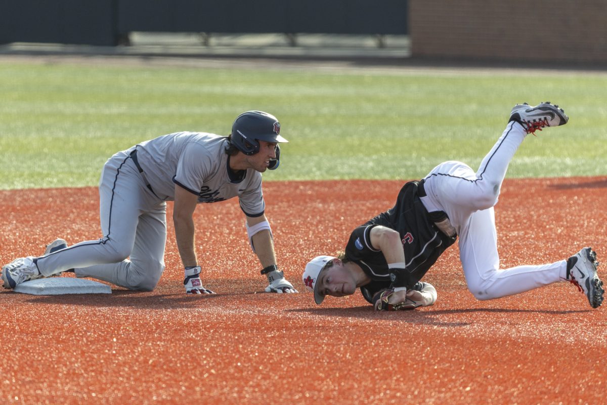 Western infielder Reid Howard (3) falls over Liberty infielder Jordan Jaffe (18) after he slid into second during Western’s game against Liberty University on Friday, April 3, 2026 at Nick Denes Field. In the first game of the WKU series on April 2, Jaffe scored two runs.