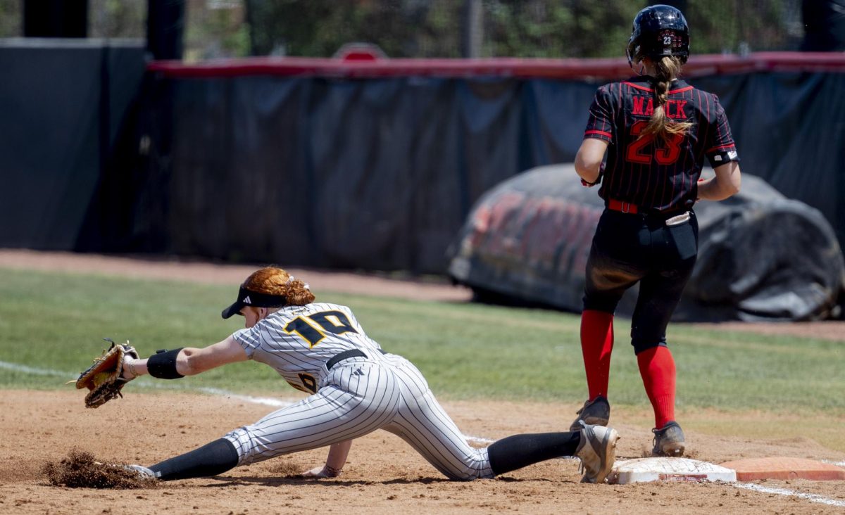 Kennesaw State Owls Catcher/First Base Savannah Frachiseur (10) attemps to out Western Kentucky Hilltoppers infeild Anna Mauck (23) as she runs into first base and is called safe during WKU’s game against the Kennesaw State Owls at the WKU Softball Complex on Sunday, April 26, 2026.