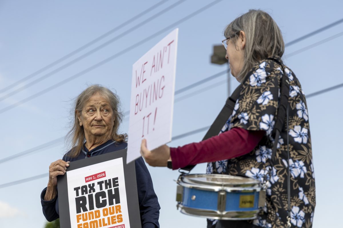 Laura Duffy (left) converses with a fellow protestor during Indivisible’s “May Day” protest for International Workers’ Day on the corner of Campbell Lane and Gary Farms Boulevard on Friday, May 1, 2026.
