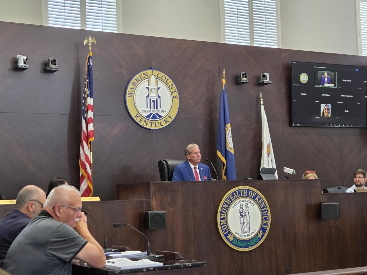 Warren County Judge Executive Doug Gorman listens to a fiscal court meeting attendant express their opinions on the data center regulation ordinance on June 11, 2026.  