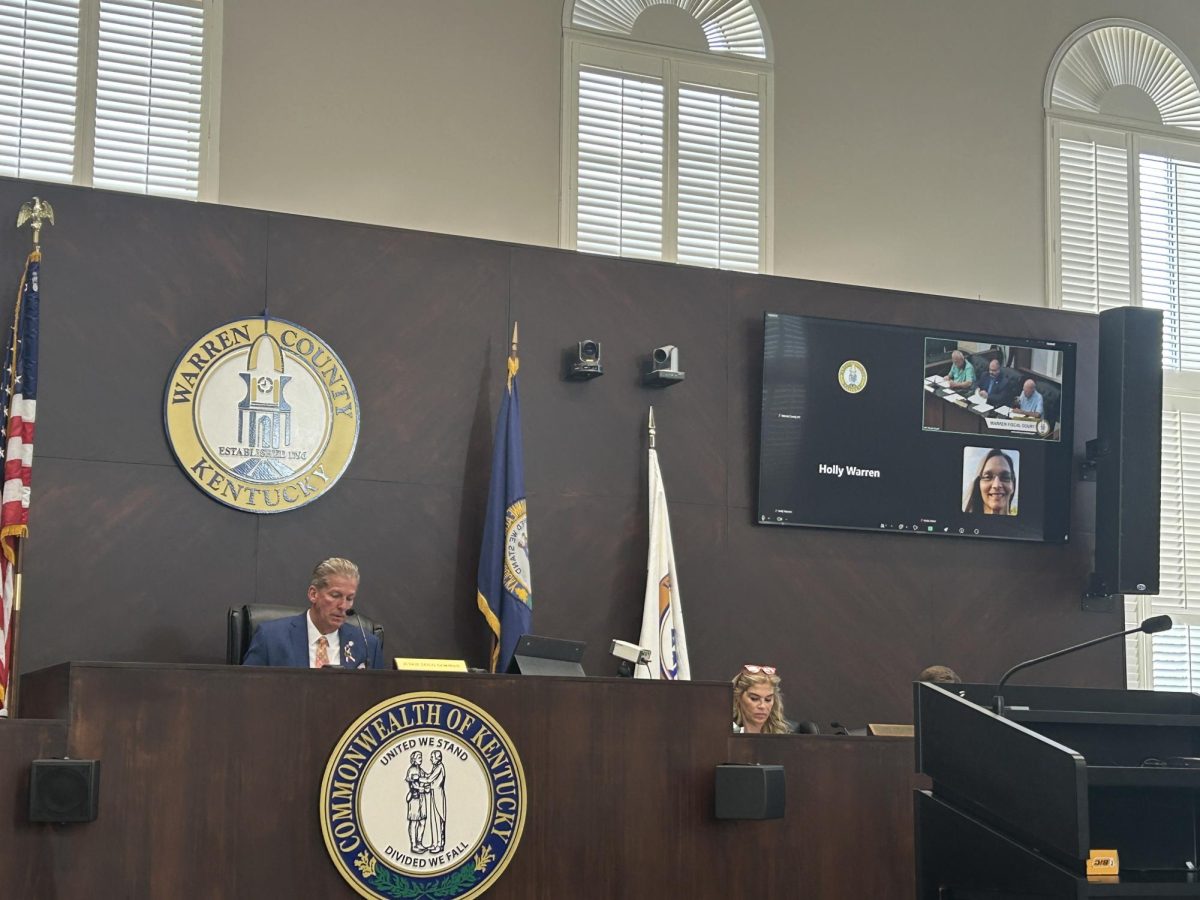 Warren County Judge Executive Doug Gorman reads through community concerns at the Fiscal Court meeting on June 25, 2026.