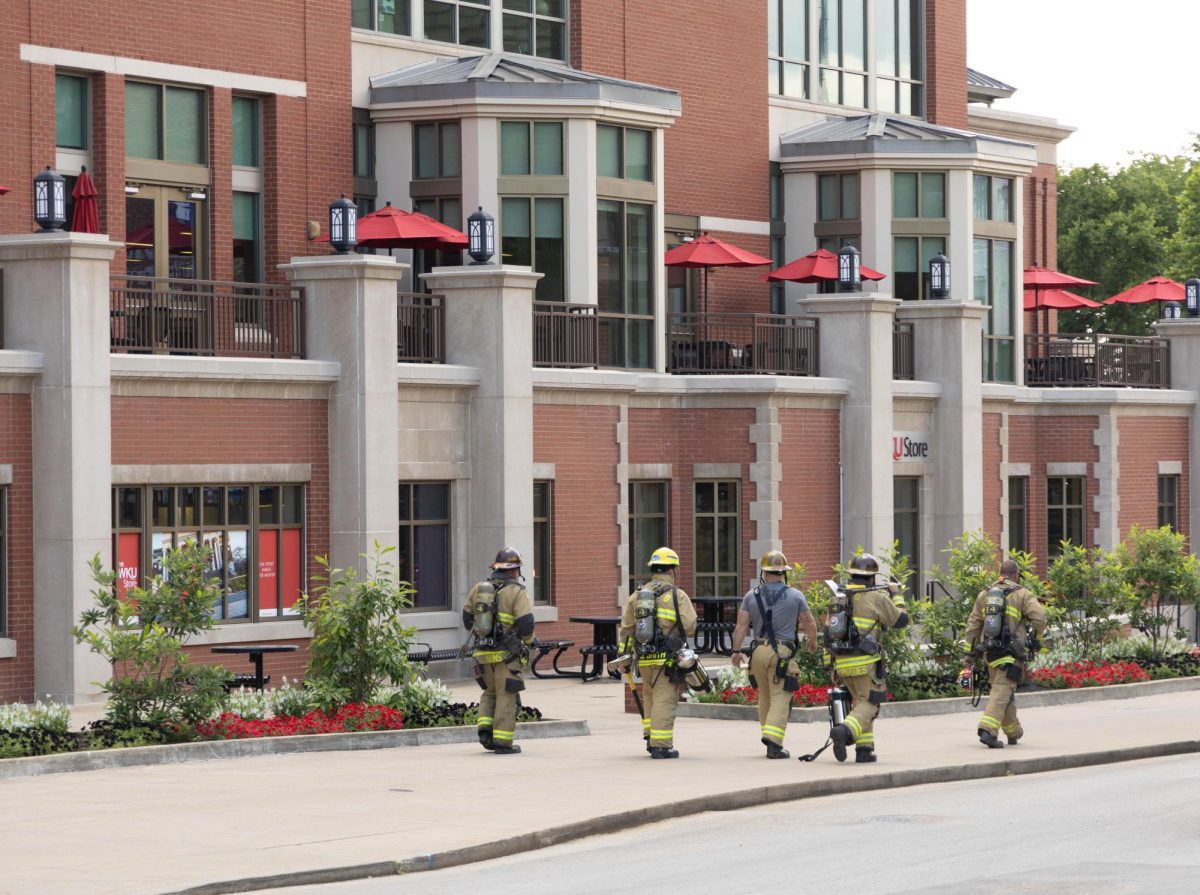 Firefighters leaving Downing Student Union after fire alarms cause an evacuation on June 16, 2026. 