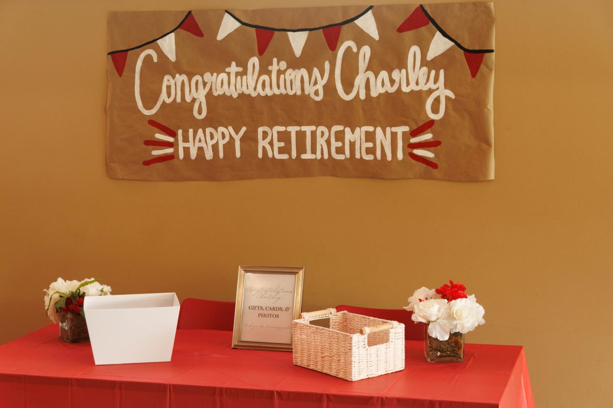 A table is set up at the front of the retirement party for people to give their printed photos they have of them and Charley Pride, former Director of Student Activities, on June 29, 2026.