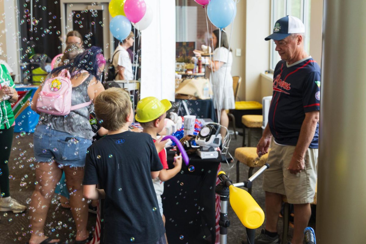 Kids play with a bubble machine at the Possibilities Expo on July 18, 2026.